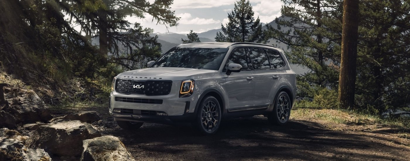 A white 2022 Kia Telluride is shown after leaving a used Kia dealer.
