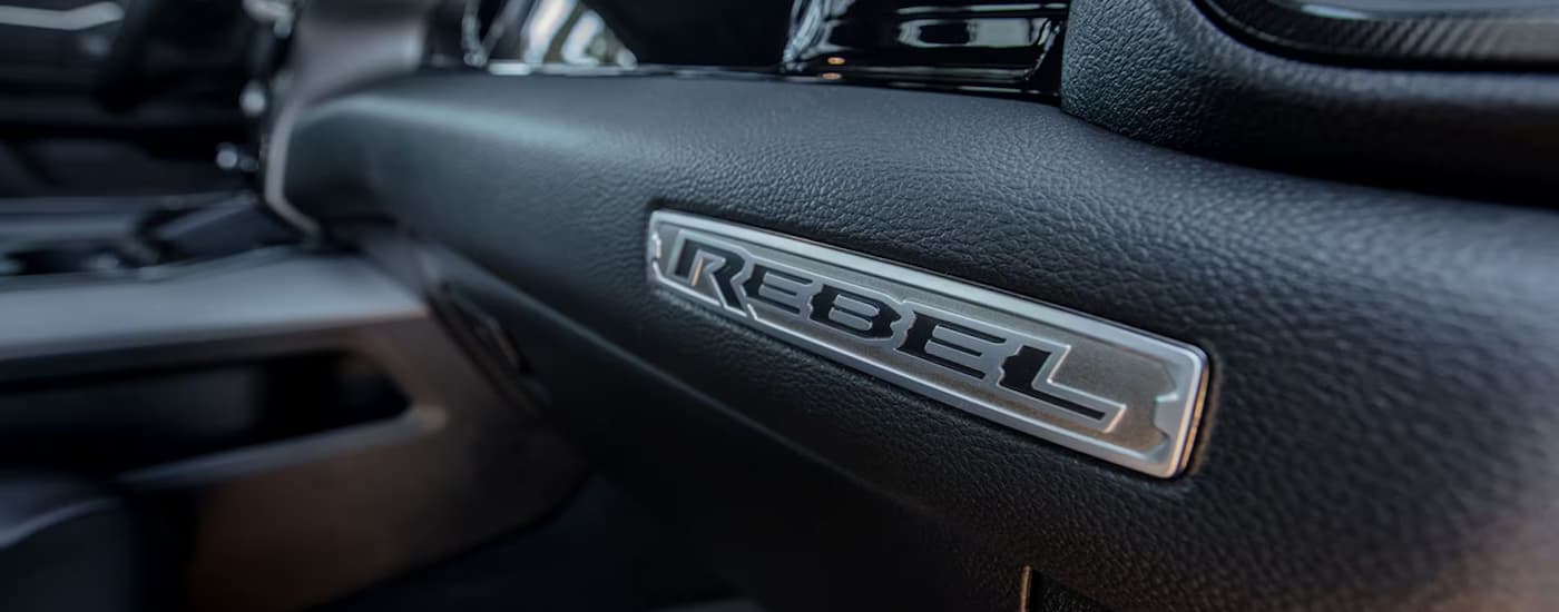 A close up of the black dashboard in a 2025 Ram 1500 Rebel for Sale in Houston.