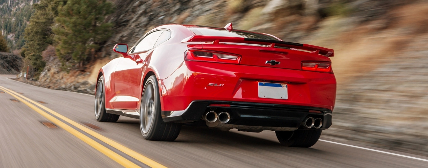 A red 2018 Chevy Camaro ZL1 is shown from the rear.