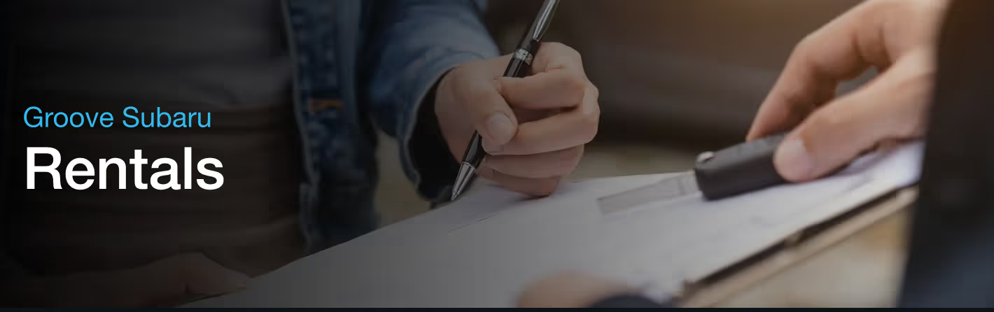A Subaru driving in the city.