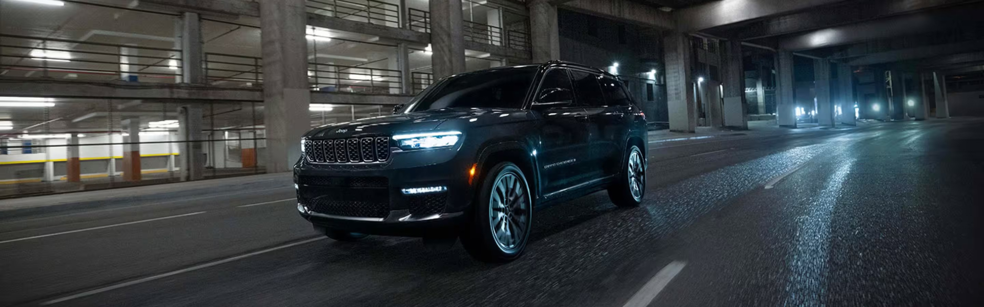 Jeep Grand Cherokee driving in a park lot
