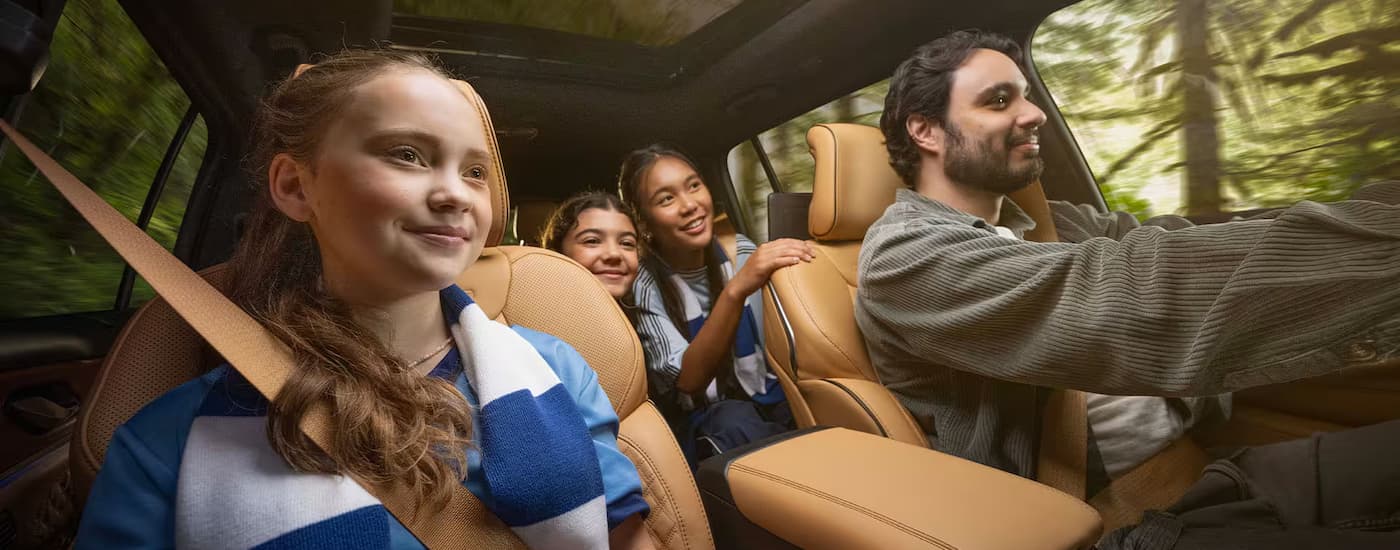 A family is driving in a 2025 Jeep Grand Cherokee.