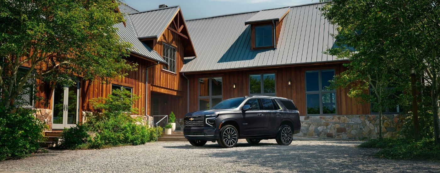 A grey 2025 Chevy Tahoe for sale near Cypress is shown from the side.