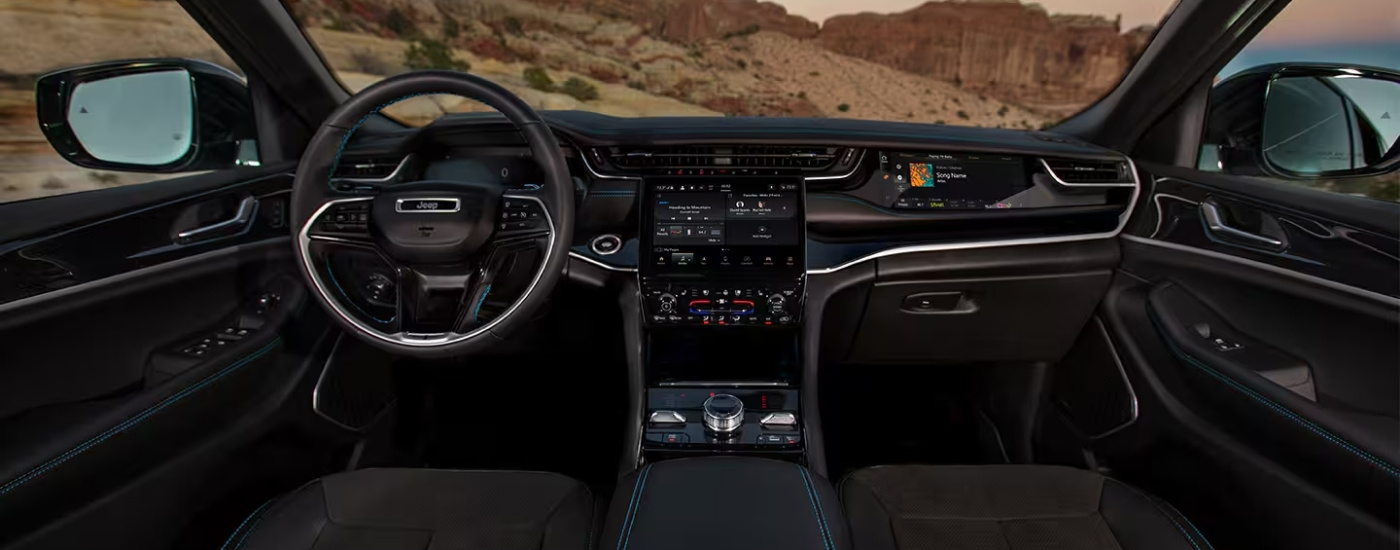 The black interior of a 2025 Jeep Grand Cherokee for sale in Houston.