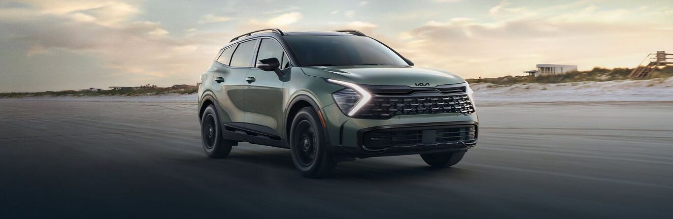 2025 Kia Sportage front view driving on a beach