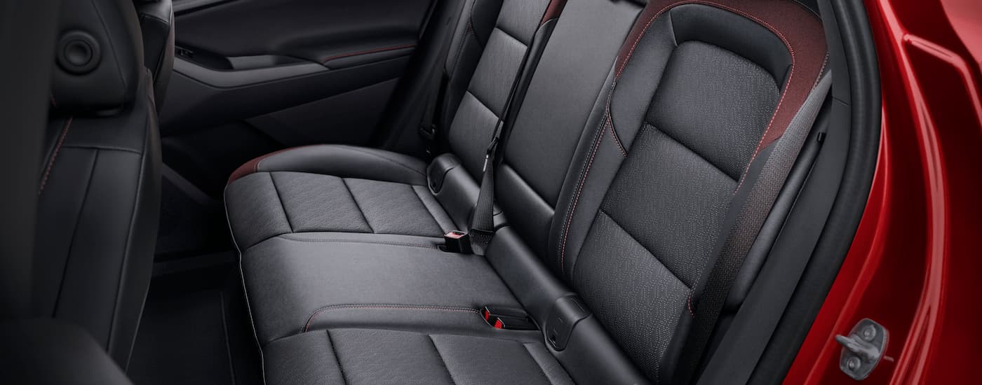 The back seat in a red 2025 Chevy Equinox RS.