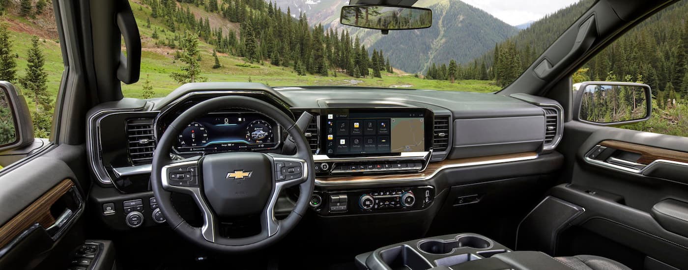 The black interior of a 2025 Chevy Silverado 1500 is shown.