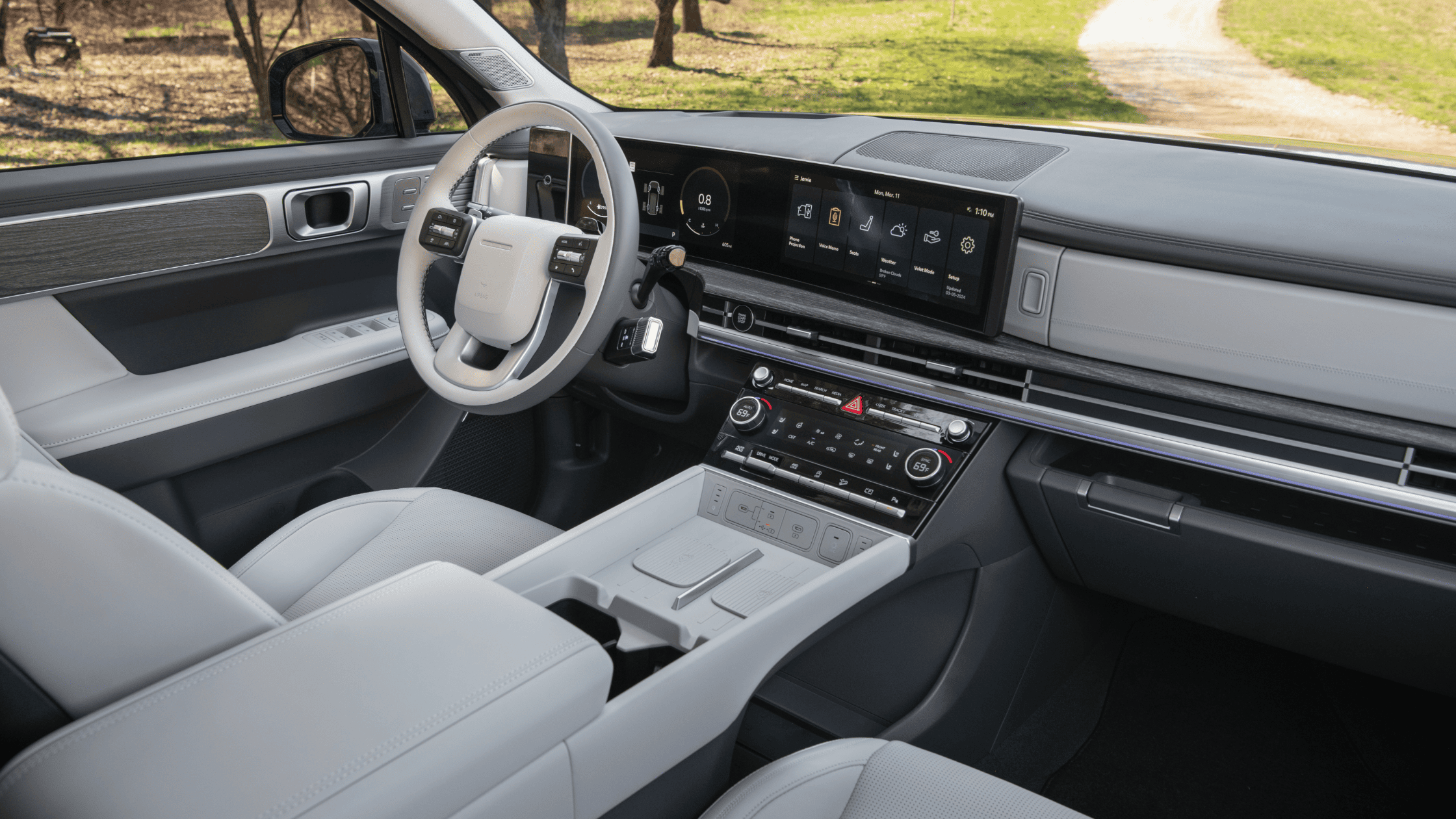 Interior of 2025 Hyundai Santa Fe featuring a wide touchscreen and minimalist dashboard layout