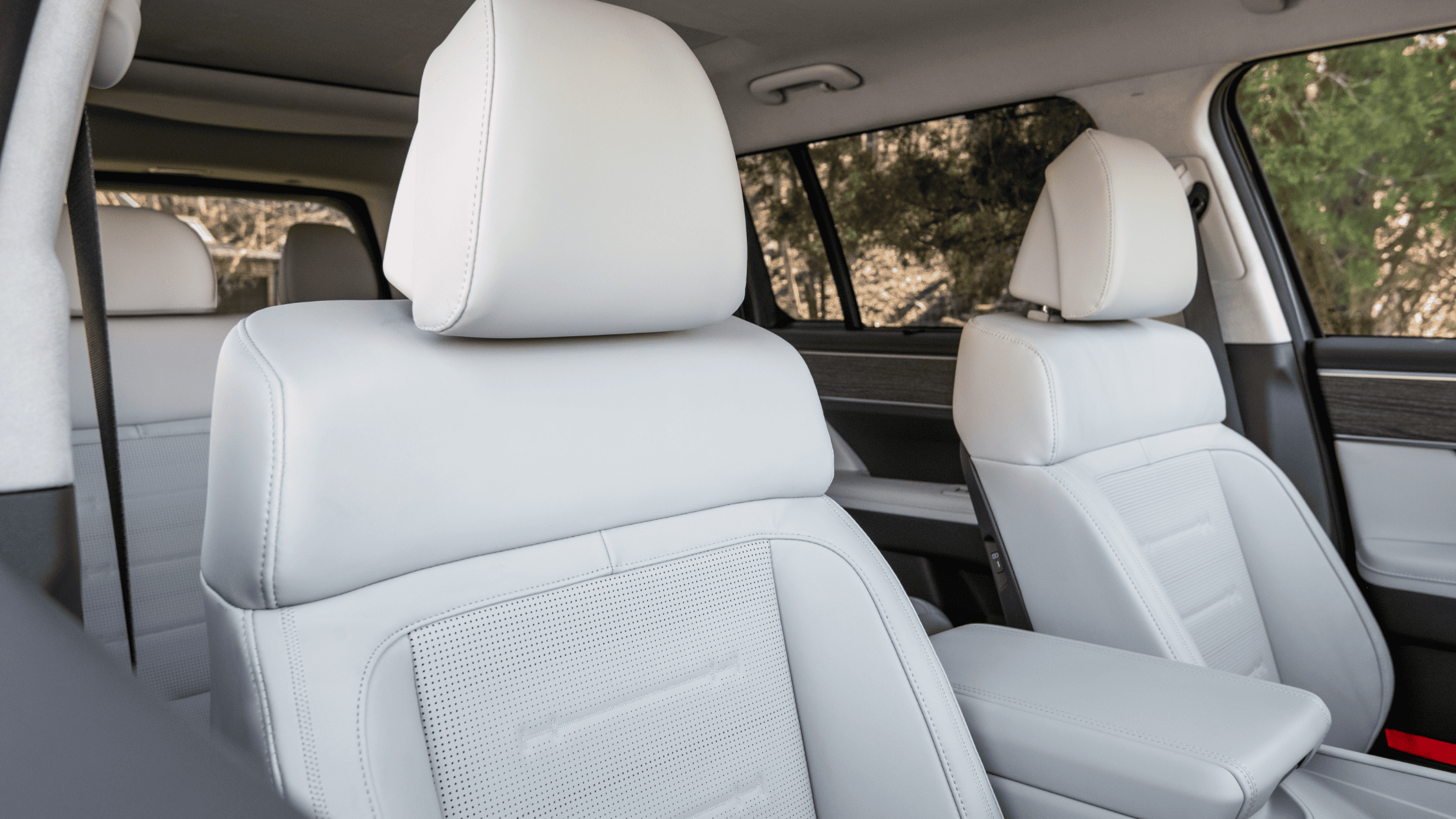 Second-row seats of 2025 Hyundai Santa Fe shown in premium light leather with spacious layout
