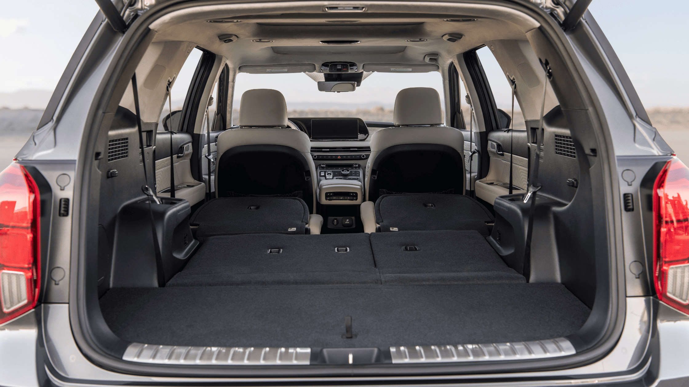 Rear cargo view of 2025 Hyundai Palisade with all rear seats folded flat for expanded storage
