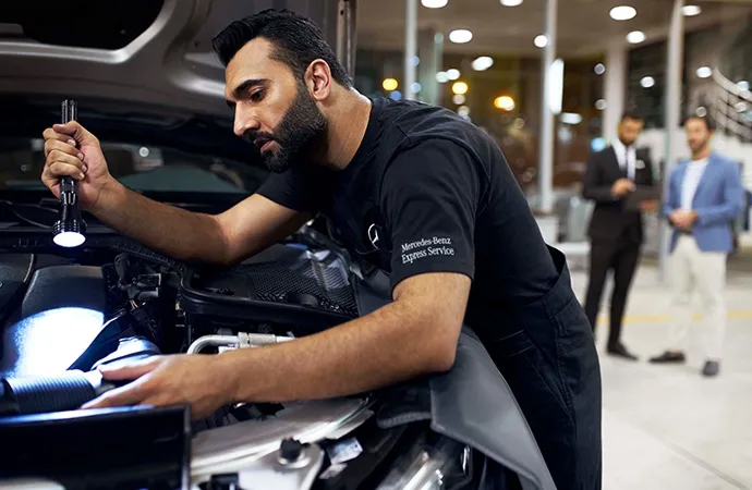 Mercedes-Benz of Lehigh Valley Technician examining engine