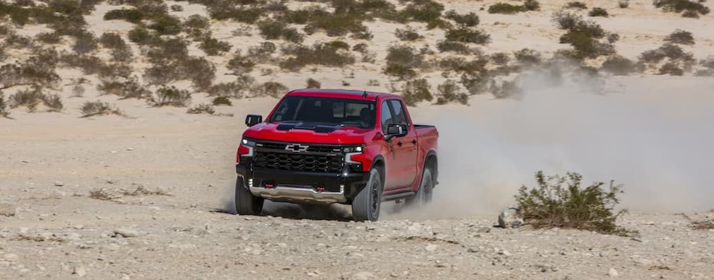 A red 2025 Chevy Silverado 1500 for sale near Omaha is shown.