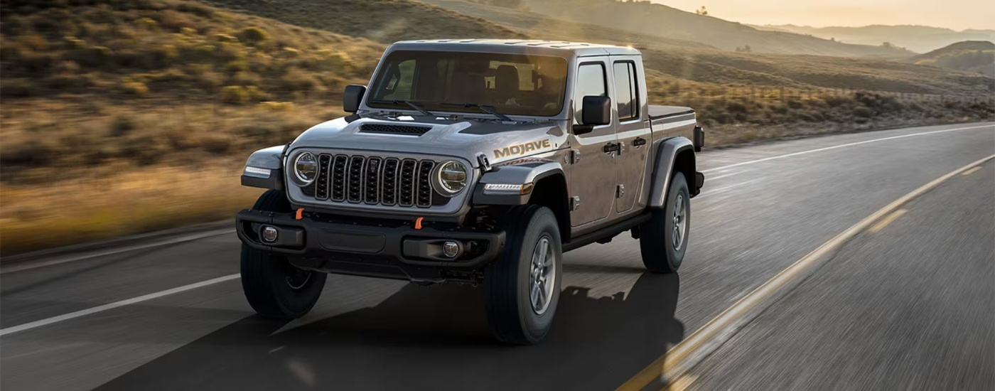 A silver 2024 used Jeep Gladiator for sale in Houston.