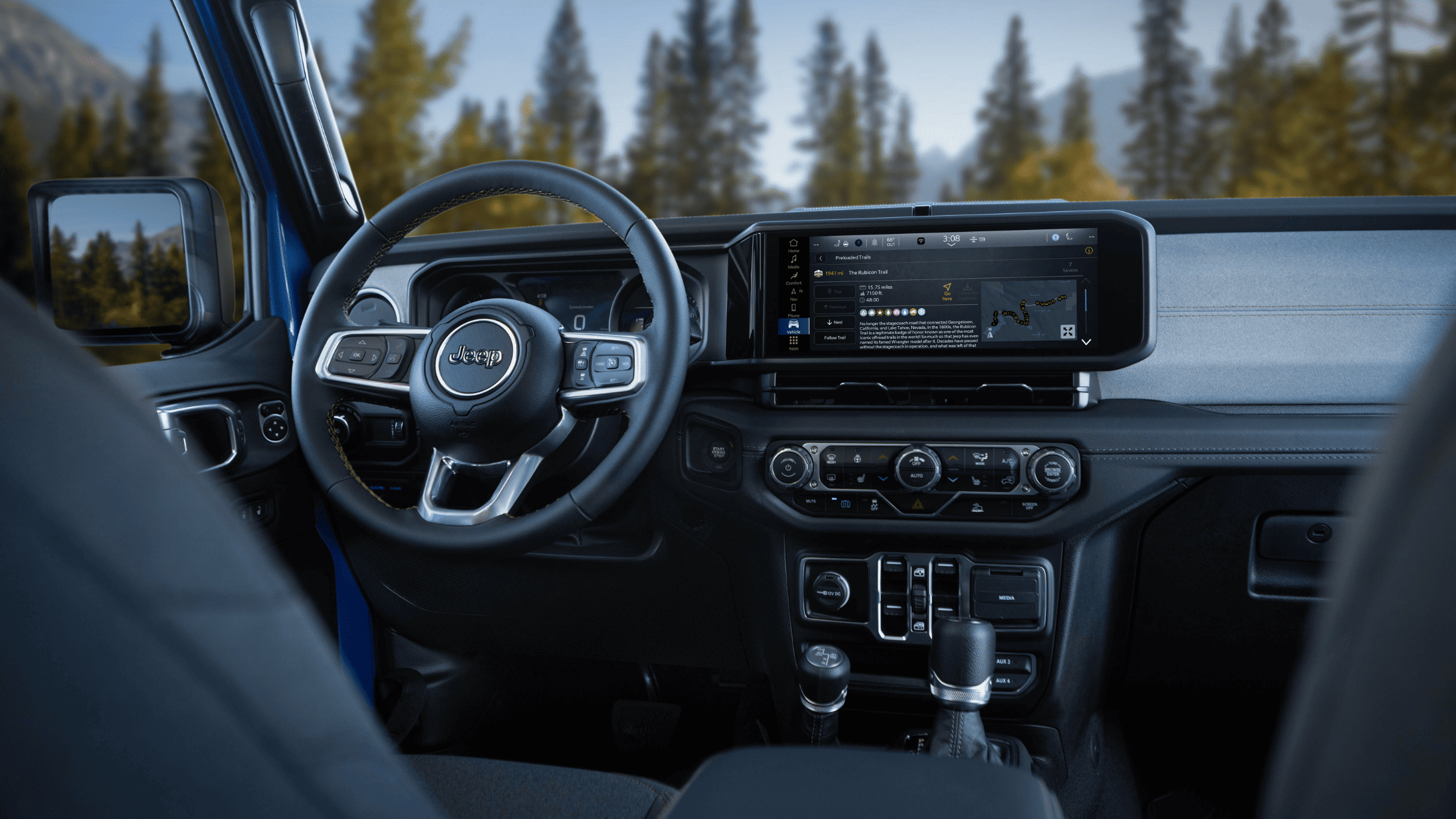 Interior top-down view of 2025 Wrangler 4xe with open roof and rugged seating layout.