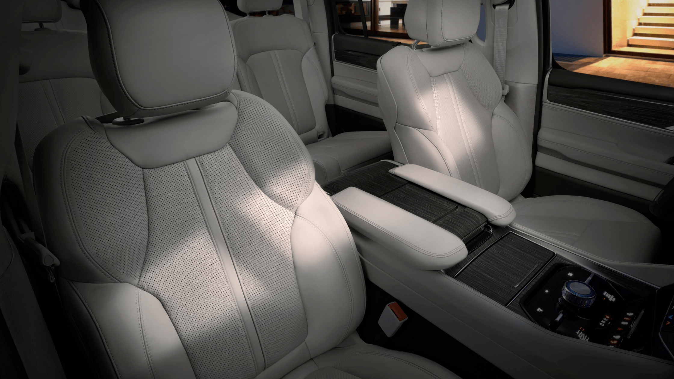 Close-up of 2025 Jeep&reg; Wagoneer front seats with perforated leather upholstery and a premium center console.