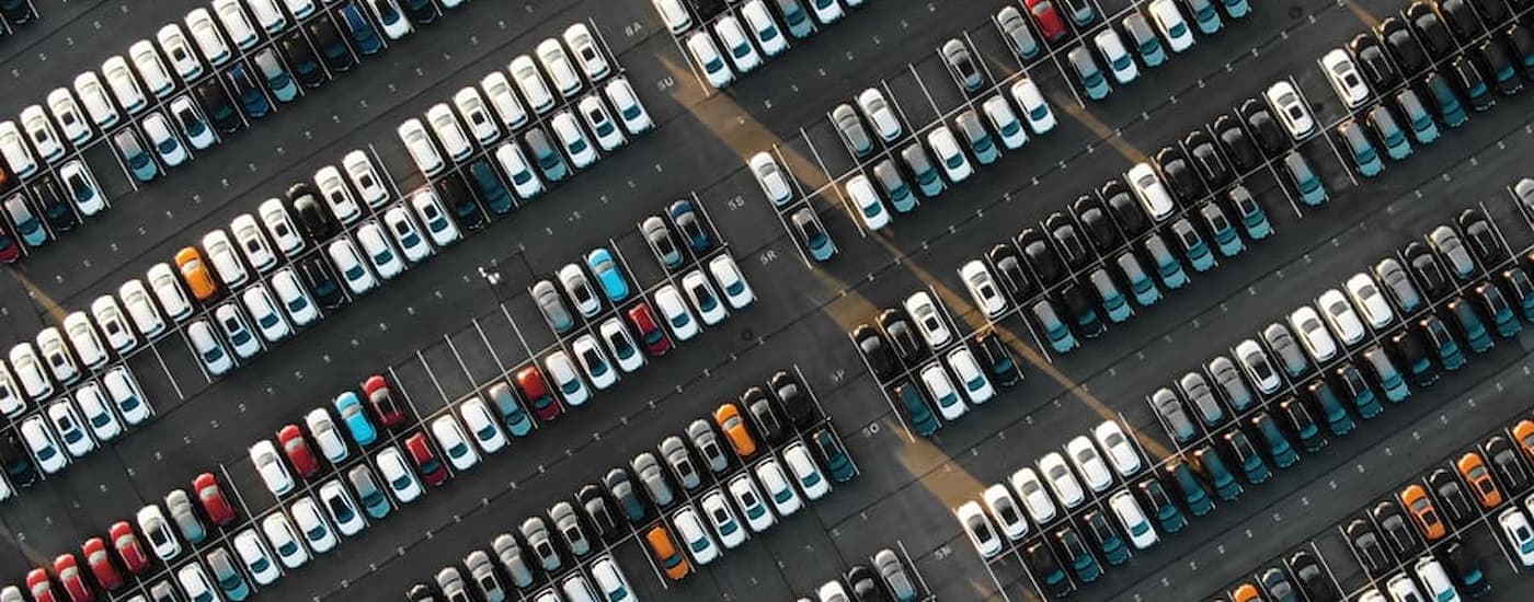 Rows of vehicles at a used car dealer.