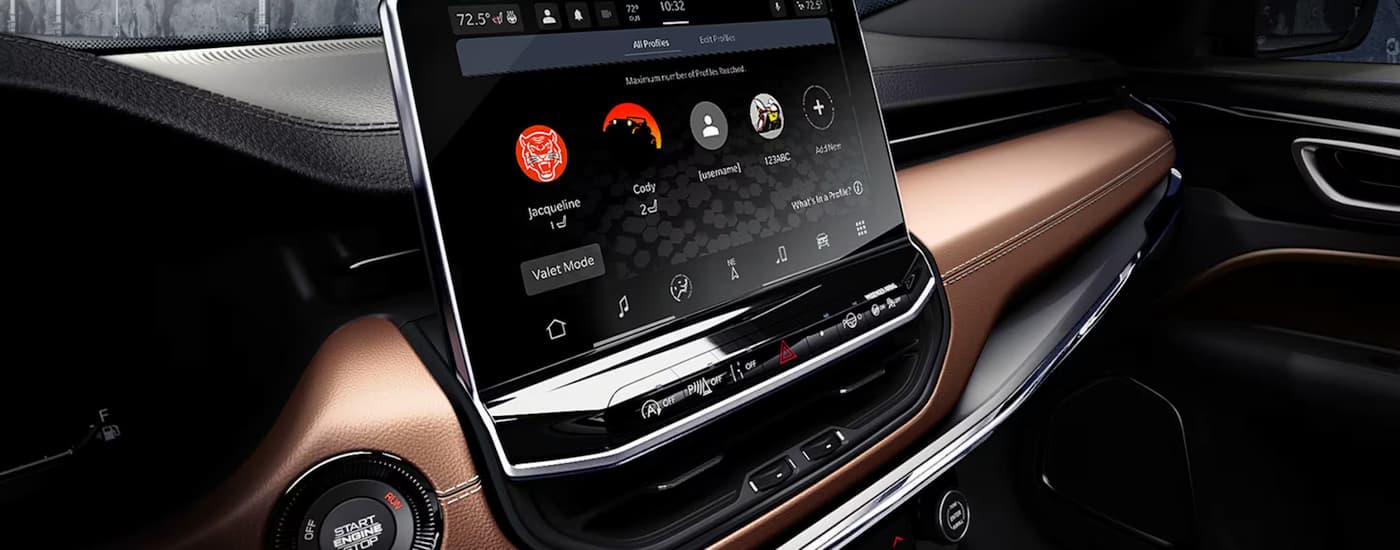 Dashboard and infotainment screen in a 2025 Jeep Compass for sale near Cypress.