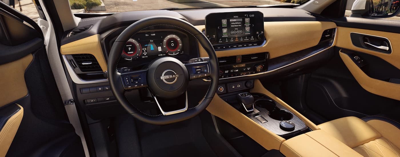 The tan interior of a 2023 Nissan Rogue.