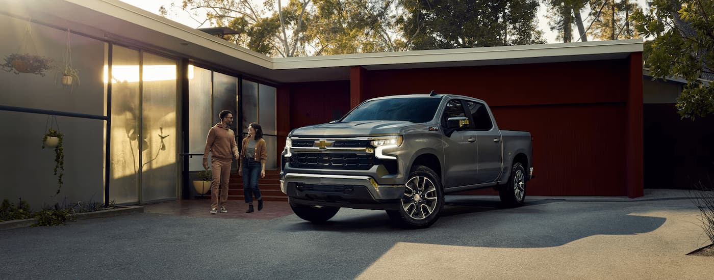 Grey 2025 Chevy Silverado 1500 parked in a driveway.