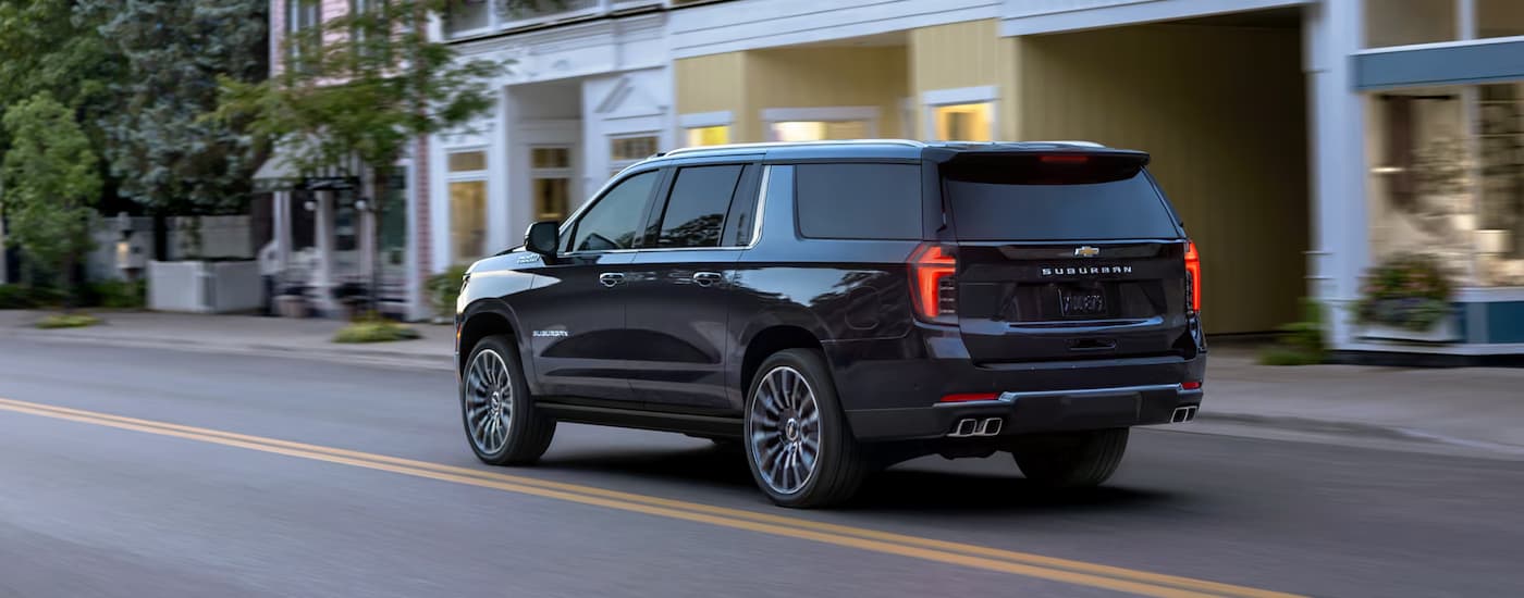 Black 2025 Chevy Suburban on a test drive at a Chevy dealer near Bellevue.