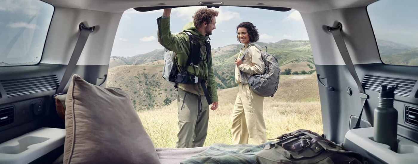 Hikers shown near a 2024 Hyundai Santa Fe.