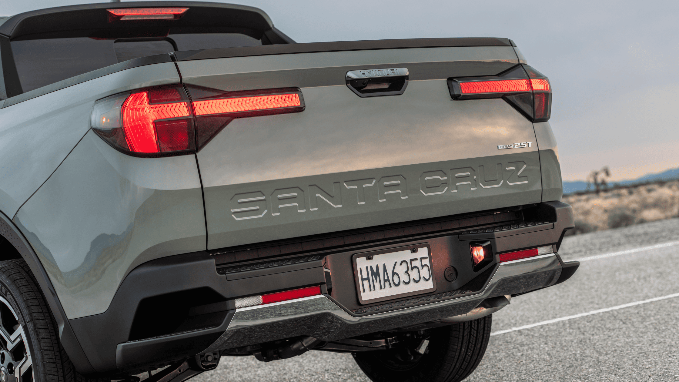 Rear view of the 2025 Hyundai Santa Cruz 2.5T with embossed tailgate and HTRAC badge.