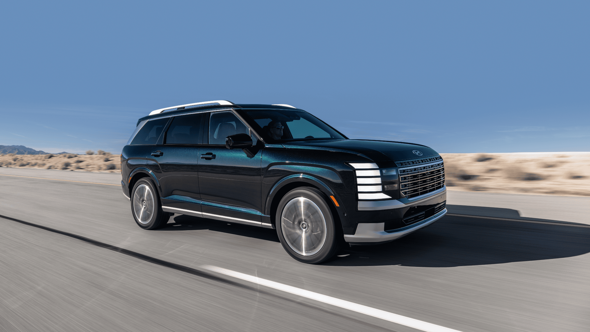 2026 Hyundai Palisade in a wooded setting near Johnson City, TN, displaying its upscale design.