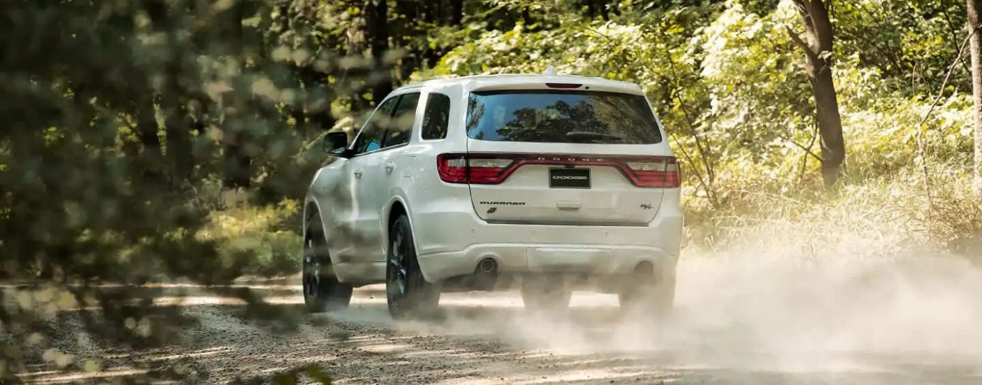 A white 2020 used Dodge Durango RT for sale kicking up dust.