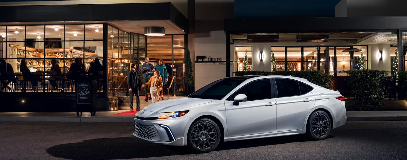 White 2025 Toyota Camry XSE for sale near Canyon Lake outside a shop.
