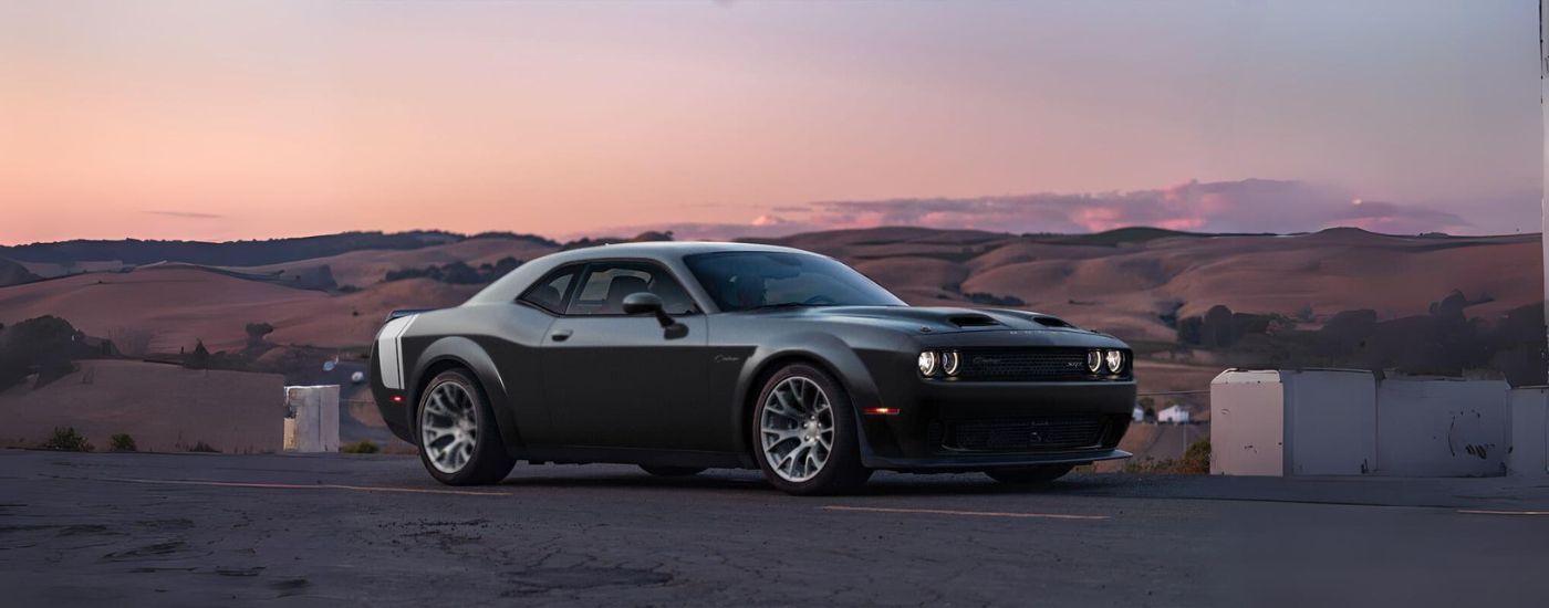 A black 2023 Dodge Challenger from the side.
