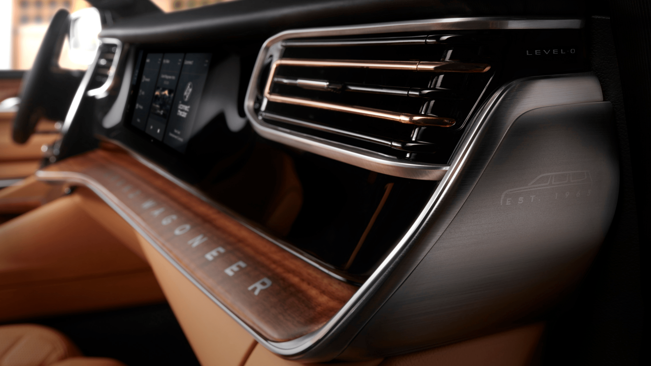 Close-up of the 2025 Jeep&reg; Grand Wagoneer&rsquo;s premium dashboard with wood trim and ambient lighting.