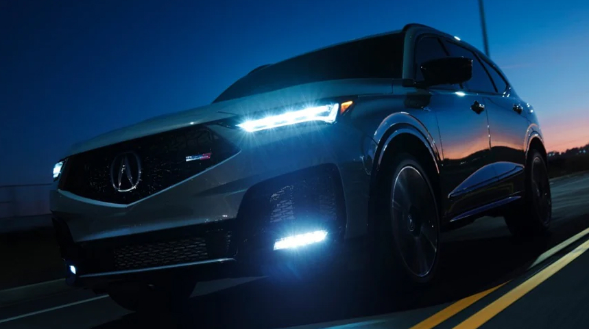 Acura SUV driving in the night