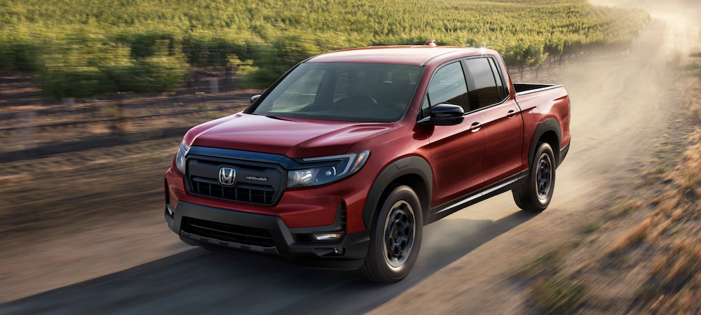 The 2025 Honda Ridgeline in Radiant Red Metallic for sale in Lafayette, LA.