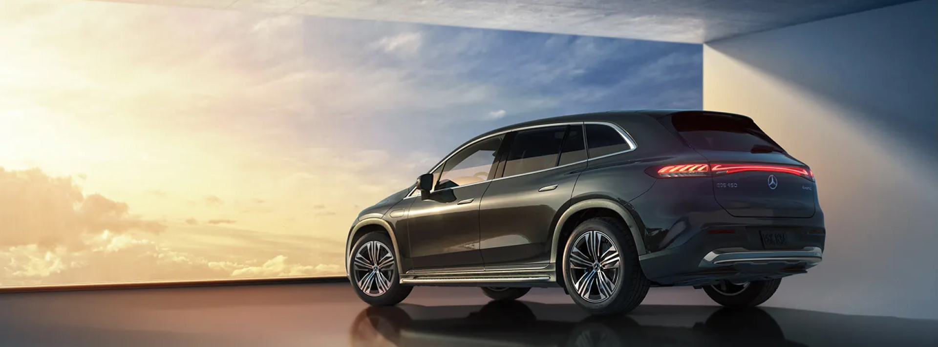 Mercedes-benz SUV parked infront of a sunset