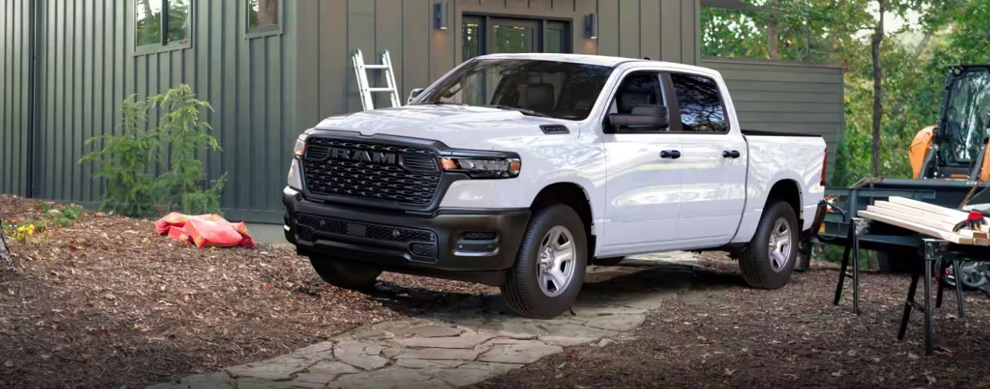 A white 2025 Ram 1500 from the front.