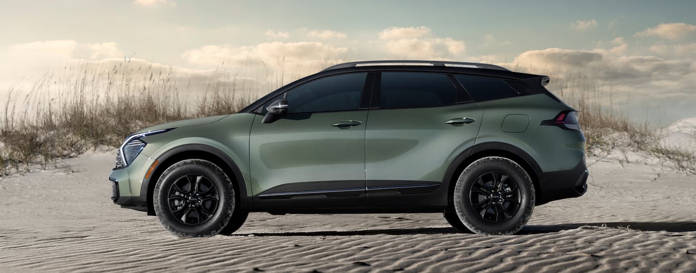 Green 2025 Kia Sorento parked on a beach