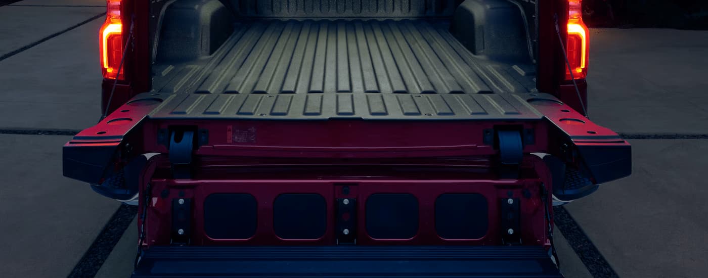 Open bed of a red 2025 Chevy Silverado 1500