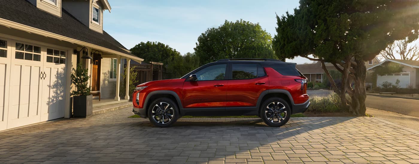 Red 2025 Chevy Equinox RS parked in a driveway
