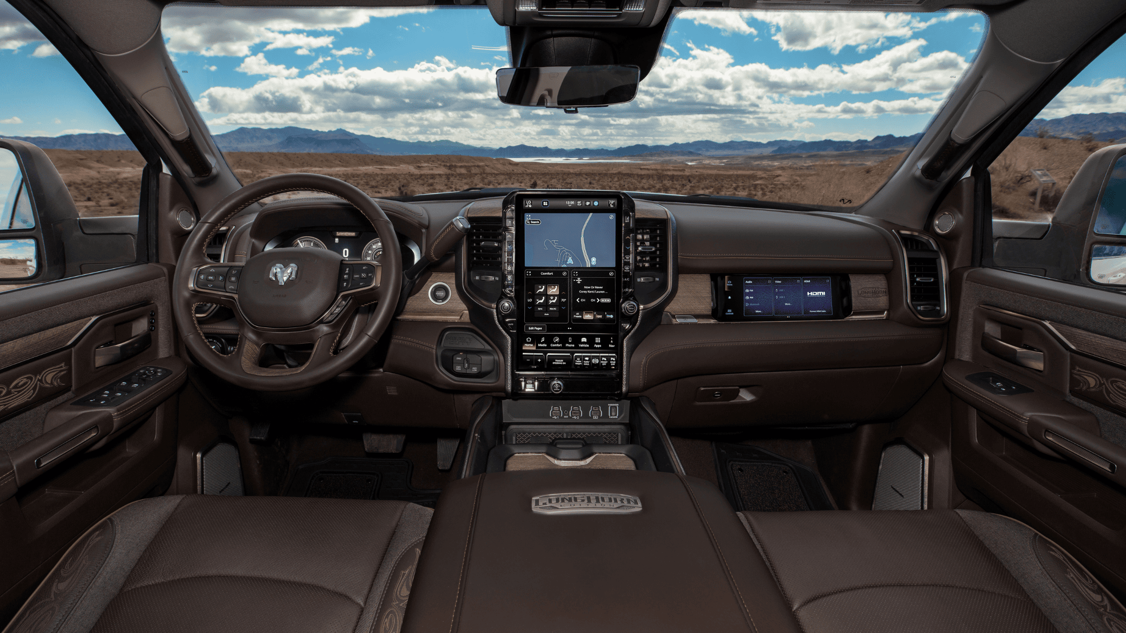 Interior front view of 2025 Ram 2500 Longhorn Edition with leather upholstery, touchscreen, and woodgrain accents.