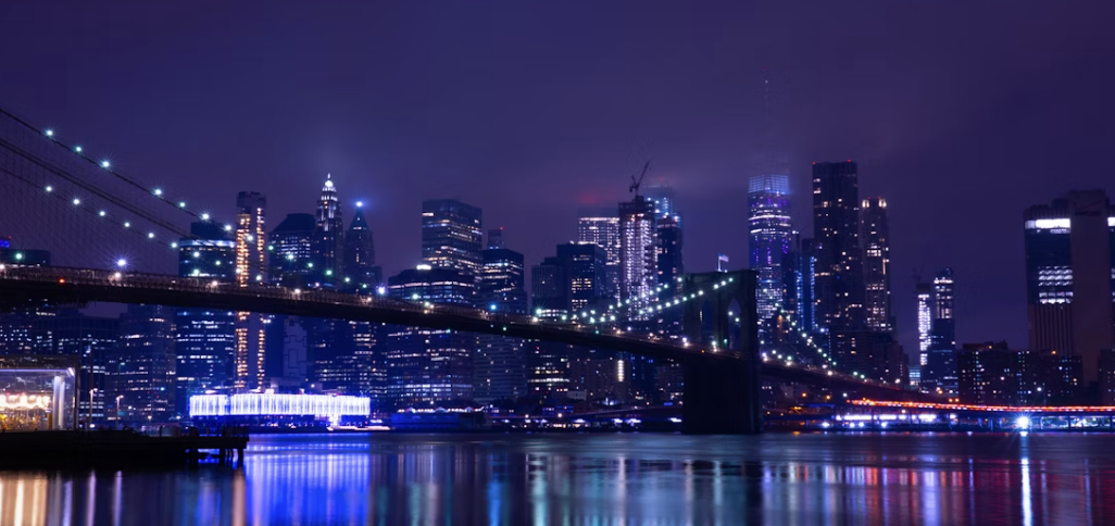 body of water across city buildings during nighttime