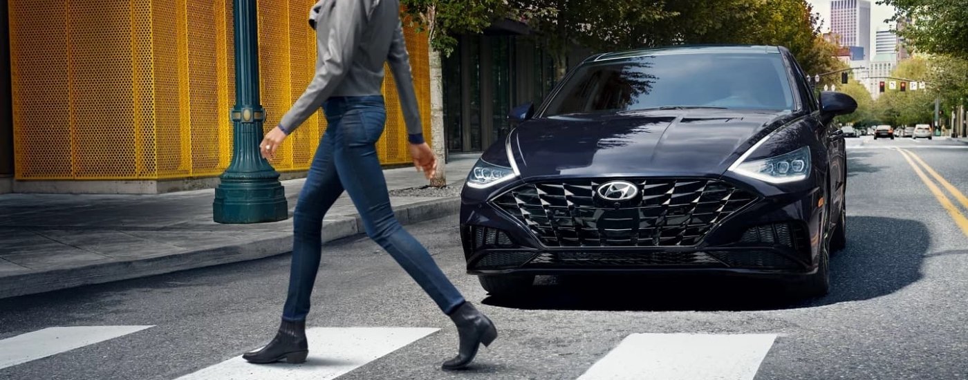 Black 2021 Hyundai Sonata stopped at a crosswalk