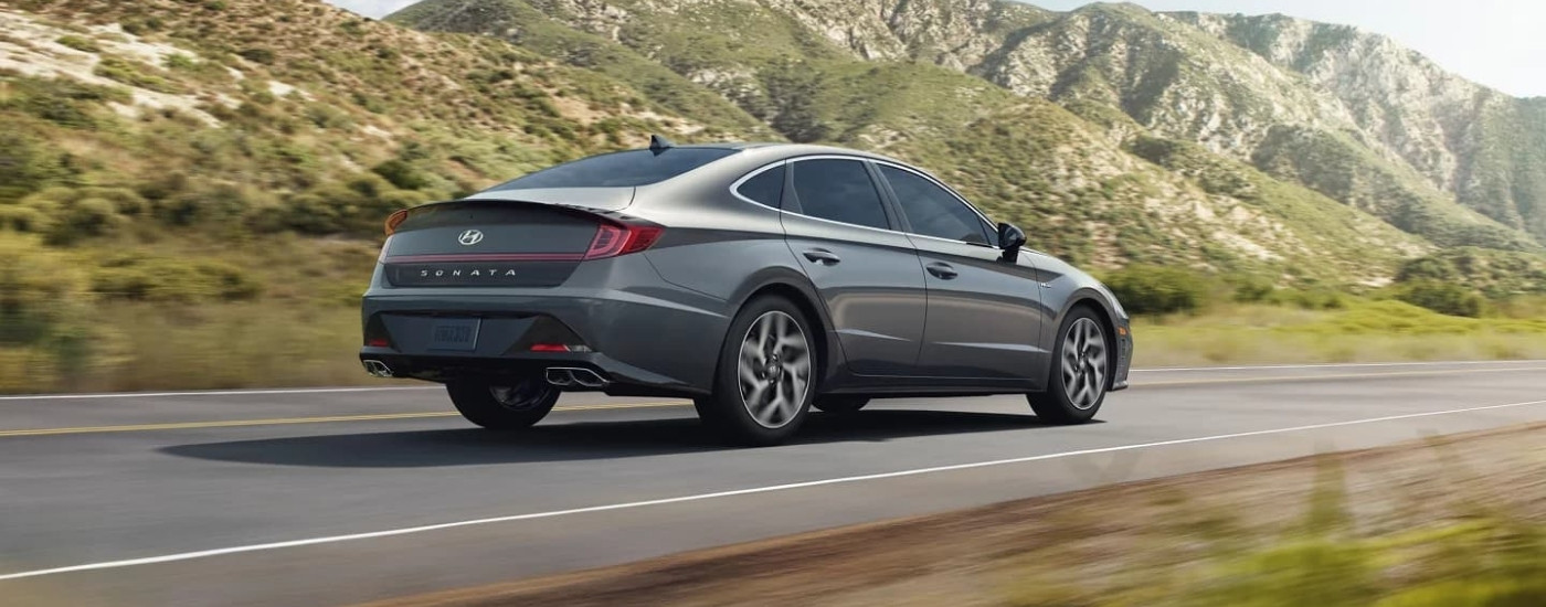 A grey 2022 Hyundai Sonata driving to a Hyundai dealer near Manvel.