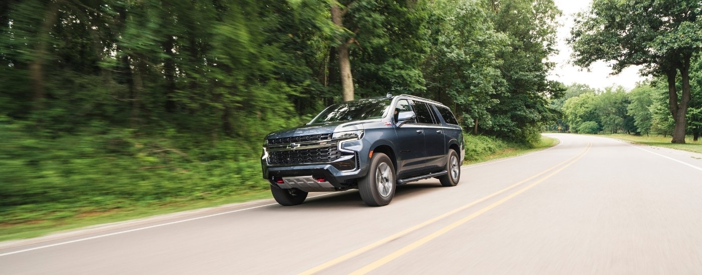 A grey 2025 Chevy Suburban from the front after leaving a Chevy dealer near Council Bluffs.