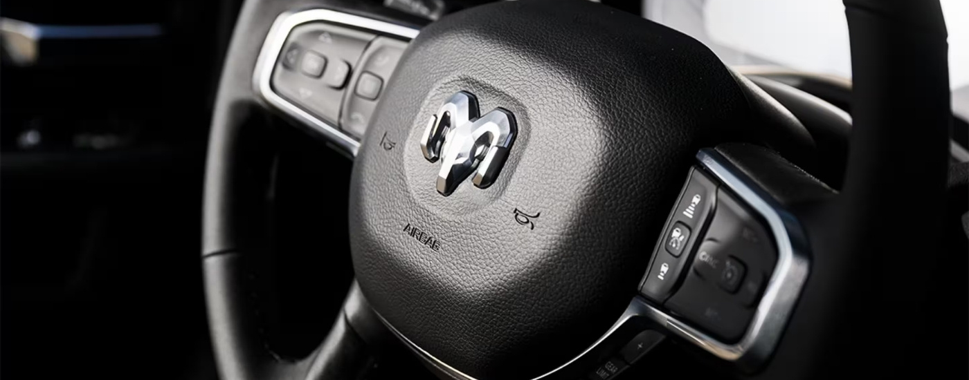 Steering wheel in a 2025 Ram 2500 at a Ram dealer near Bellevue.