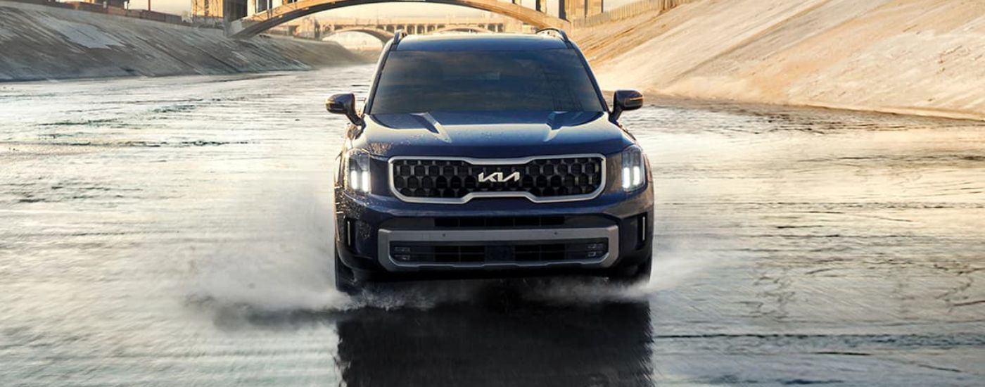 Blue 2024 Kia Telluride for sale near Gretna driving through water