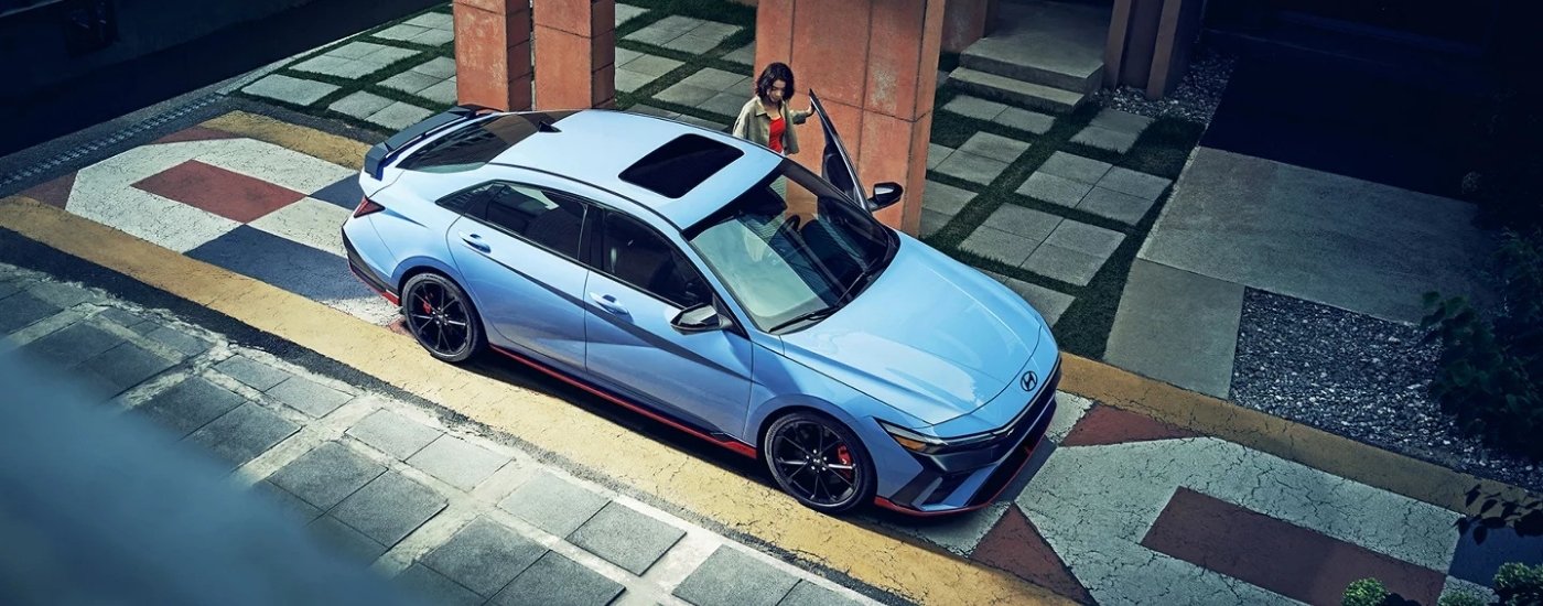 A blue 2025 Hyundai Elantra N from the side.