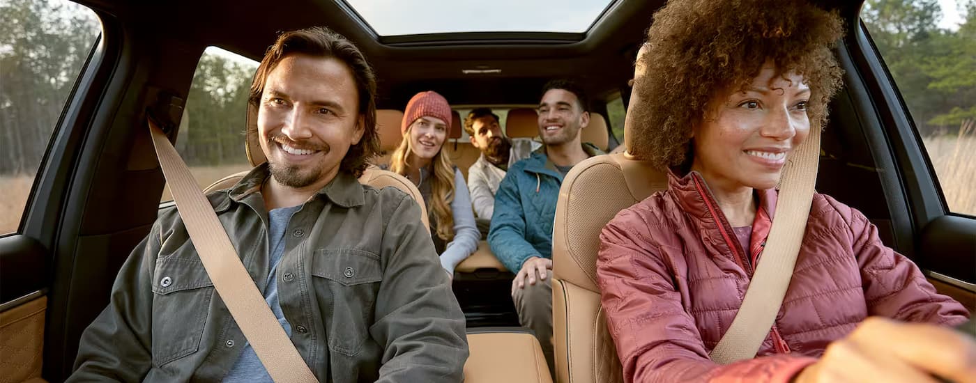 Group of friends driving in a 2025 Jeep Grand Cherokee L for sale