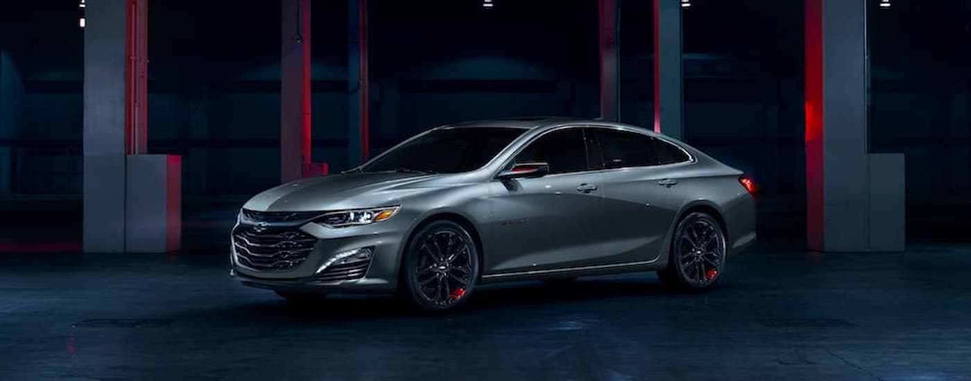 A silver 2024 Chevy Malibu from the side.