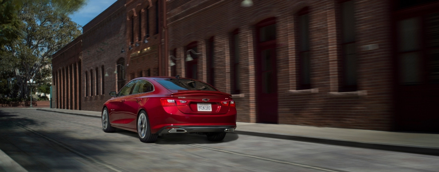 A red 2021 Chevy Malibu from the rear.