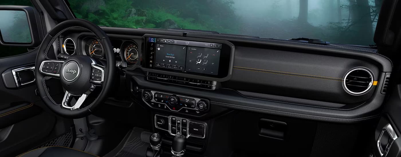 Infotainment display and digital gauge cluster on a 2025 Jeep Wrangler for sale